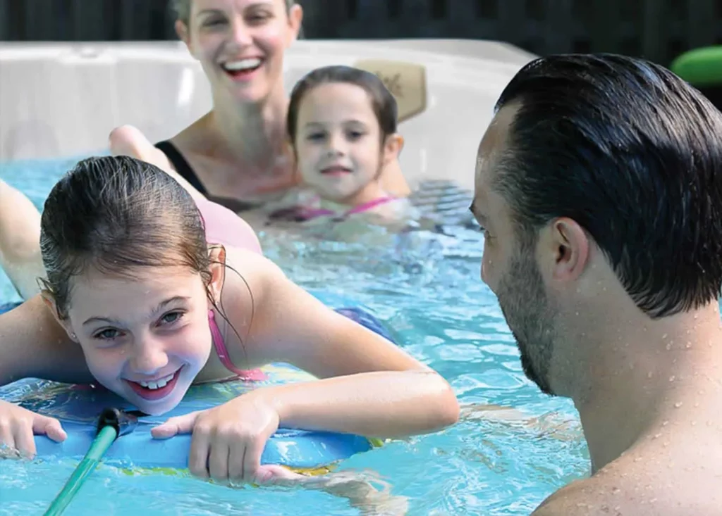 Health Benefits - Atlanta Hot Tub Center kids enjoy play time in a 12 ft swim spa all season pool